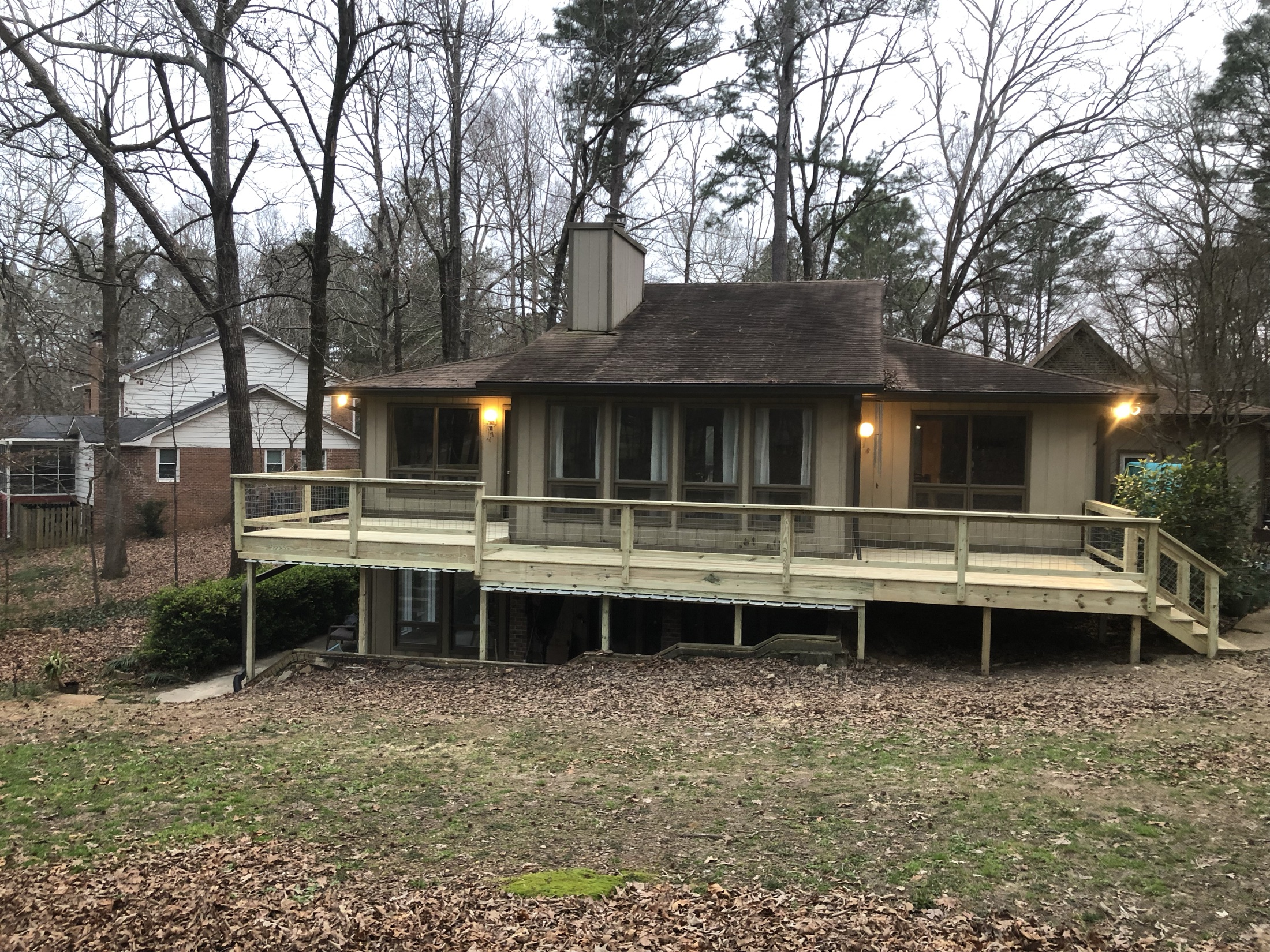 Deck with railing built by Redbone Woodworks