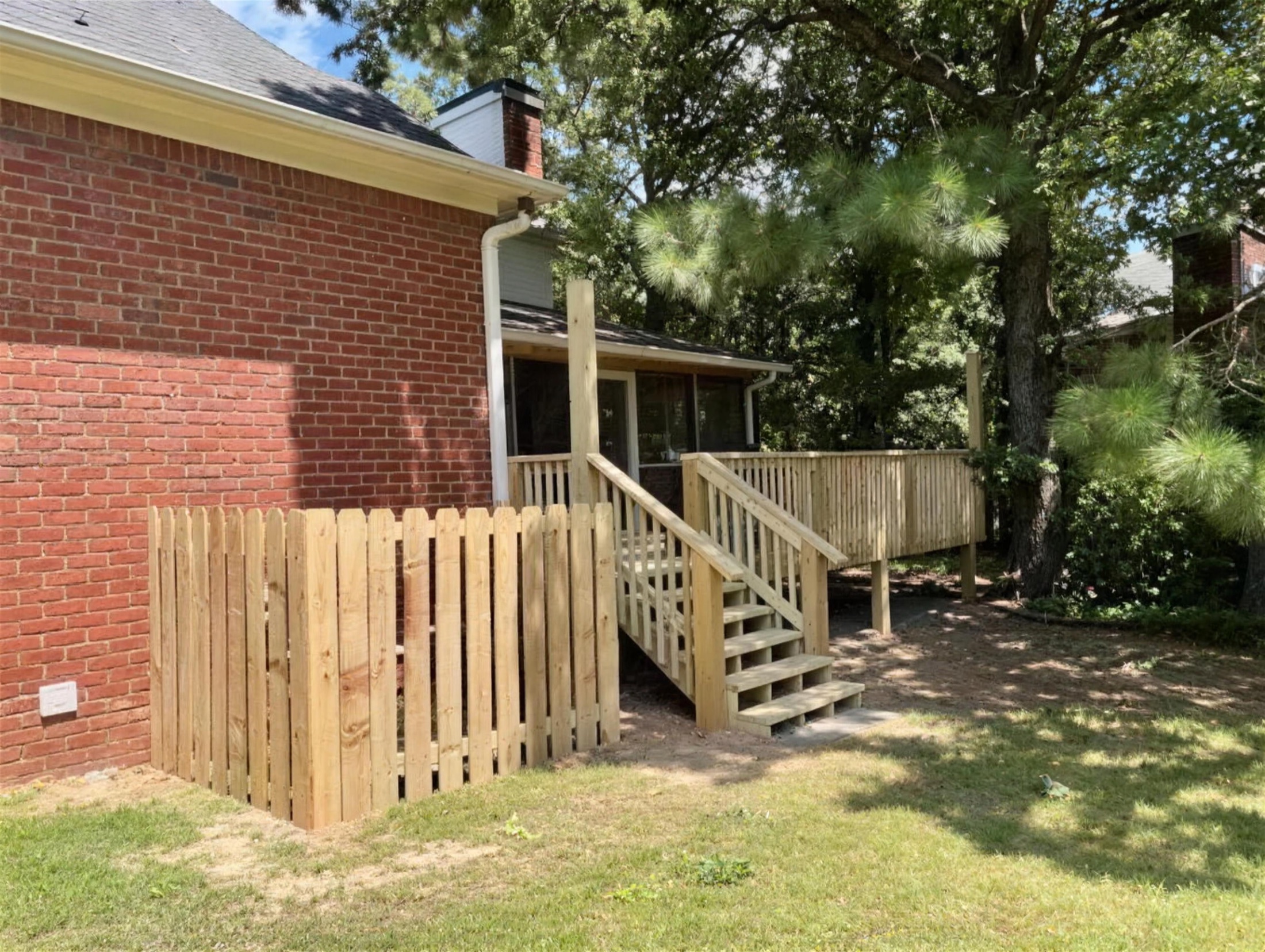 Screened porch exterior built by Redbone Woodworks